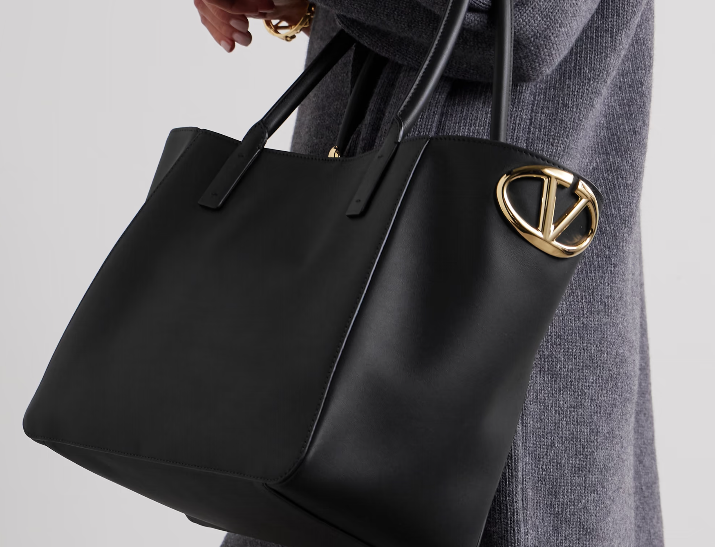 A stylish and trendy quilted leather tote bag from the 2024 collection, featuring gold-tone hardware and spacious compartments, perfect for elevating any outfit.