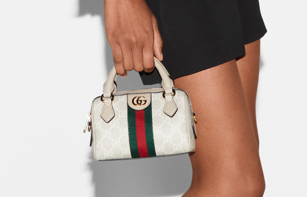 An elegant Gucci GG Supreme Boston bag from the 2024 collection, showcasing the signature GG canvas and leather trims, perfect for both casual and formal occasions.
Image 3: